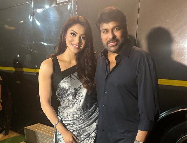 Chiranjeevi happily flirts with Urvashi Rautela at the Press meet of Waltair Veerayya in the mega 350cr film starring Ravi Teja