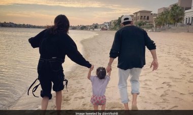 Virat Kohli posts a family photo while walking on the beach and says, "Thank You, God."
