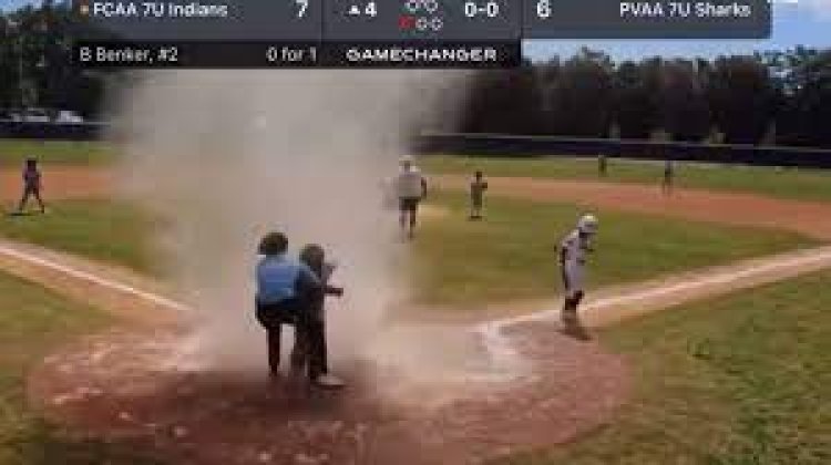 Baseball umpire rescues child from dust storm: Florida baseball ground incident