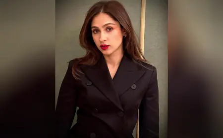 Pashmina Roshan's Timeless Glamour: A Stunning Black Suit Ensemble with Flowing Tresses and Bold Red Lipstick