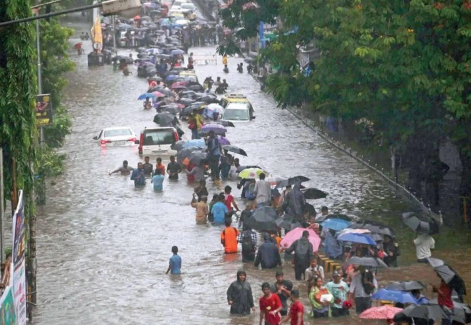 Heavy rain hits Mumbai, public services are halted, flights are canceled, train services are disrupted, and schools are closed