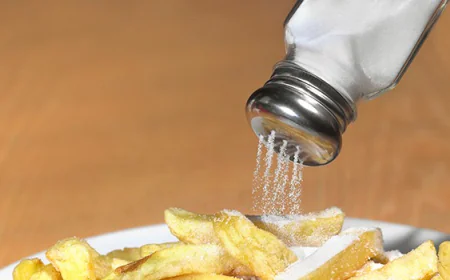 Sprinkling Extra Salt on Food? These Signs Show You’re Eating Too Much Sodium
