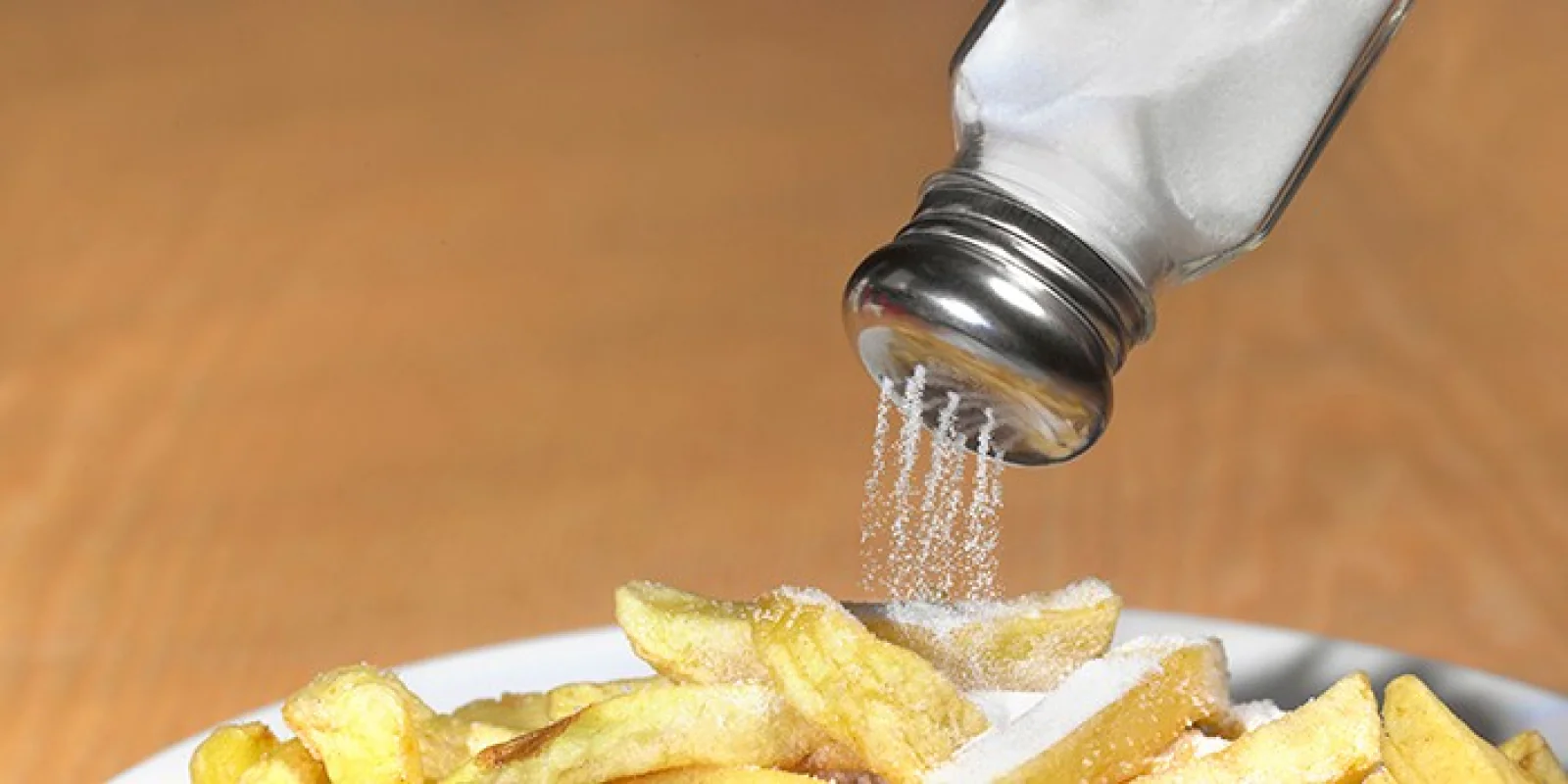 Sprinkling Extra Salt on Food? These Signs Show You’re Eating Too Much Sodium